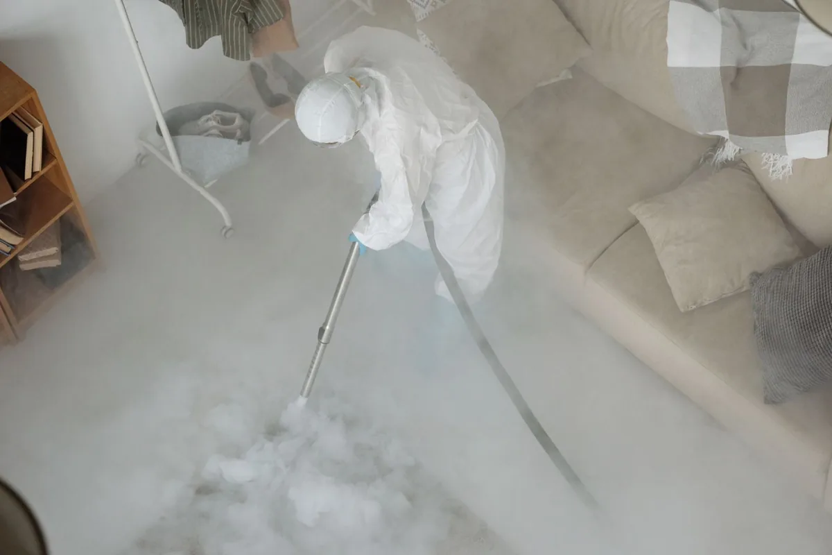 Biohazard cleanup technician in protective equipment, Hunters Creek Village, TX